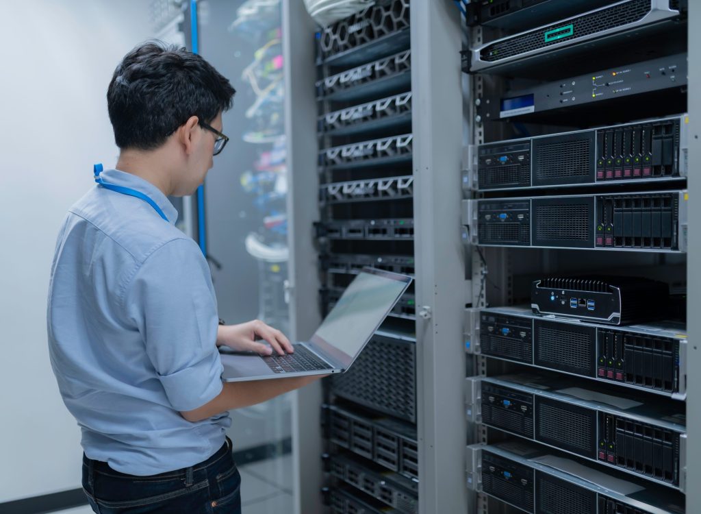 Computer,Engineer,Is,Setting,Up,Network,In,Server,Room,systems,Maintenance